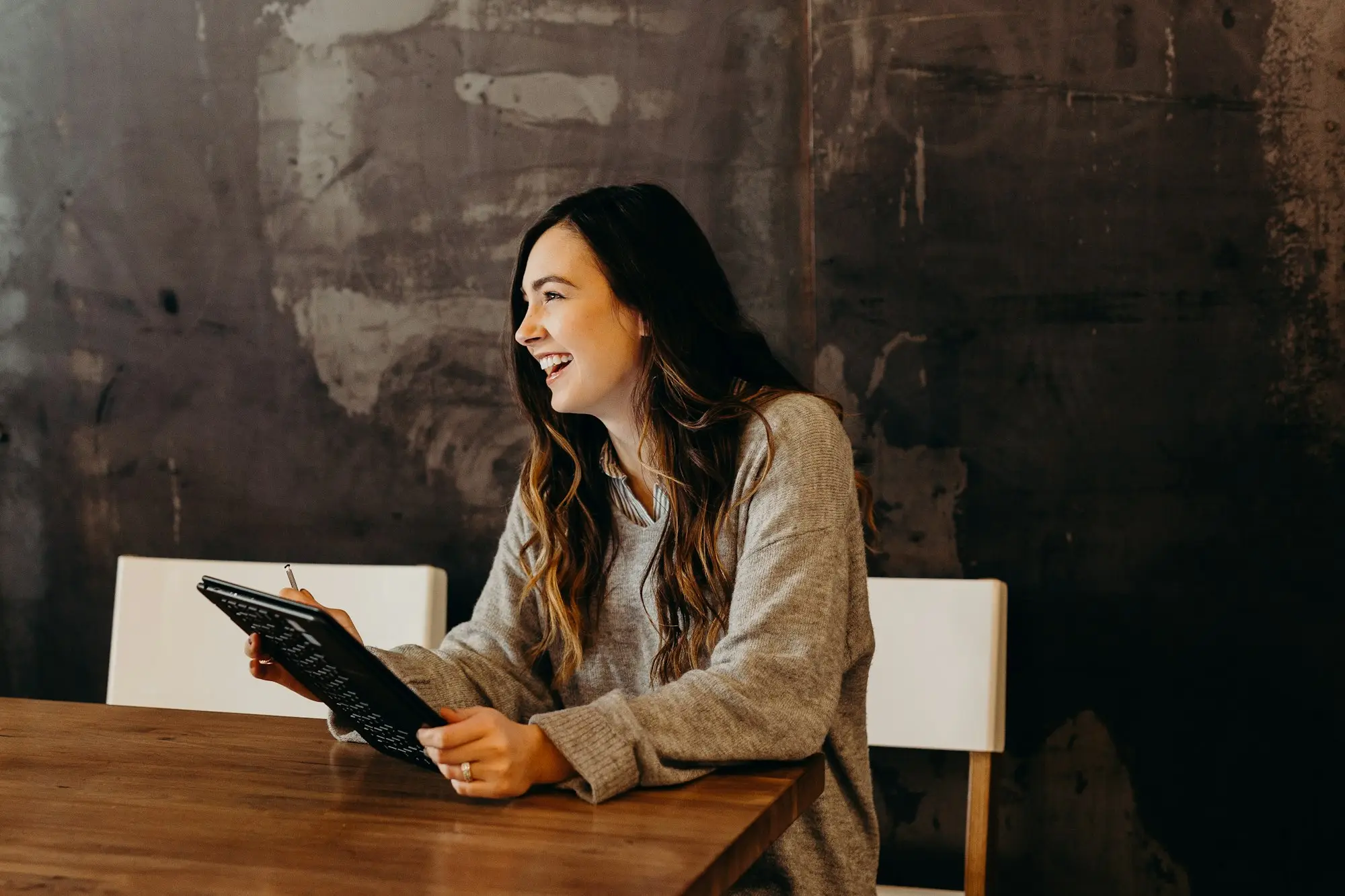 Cafe owner checking a credit report on a tablet
