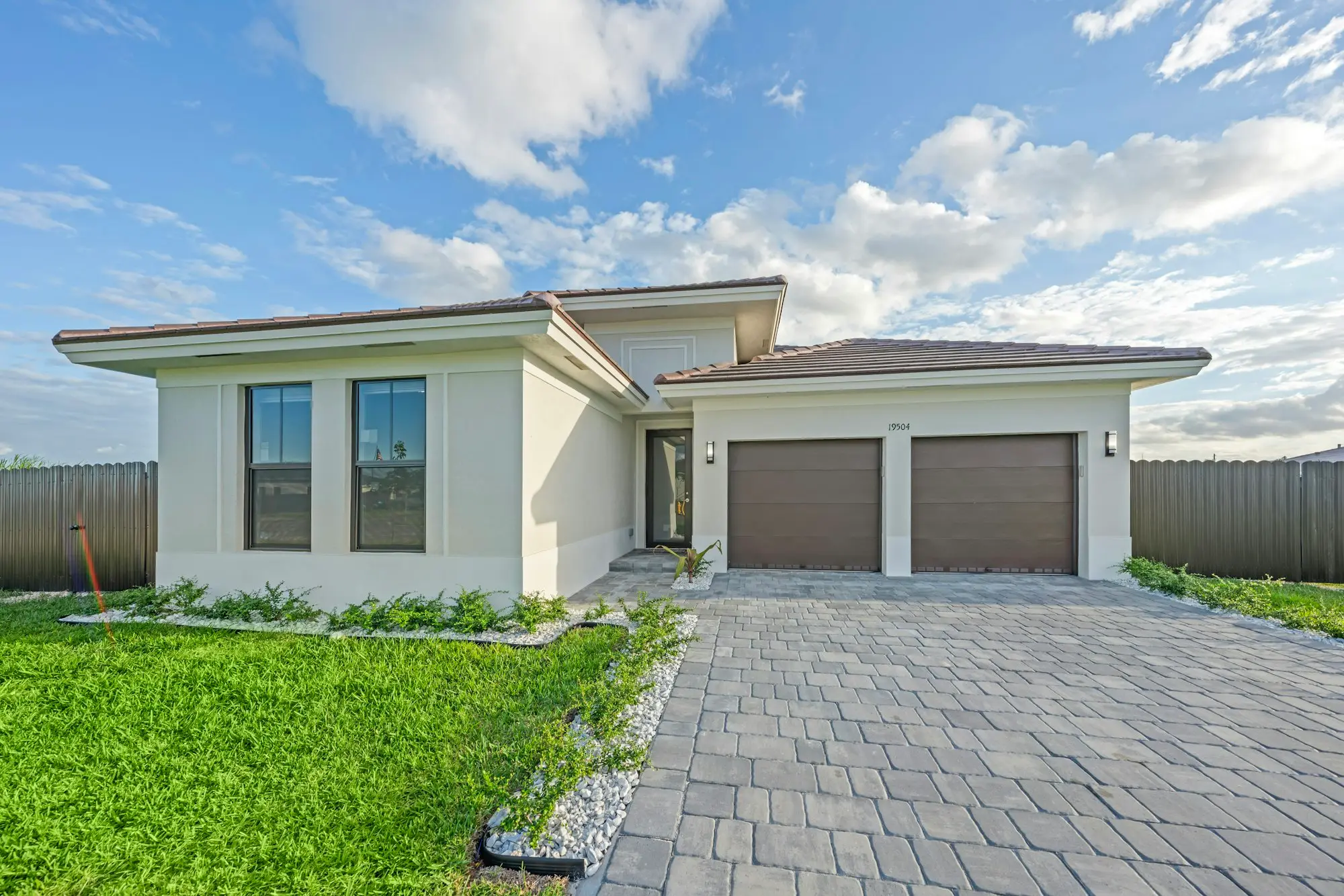 Modern family home with a double garage and paved driveway