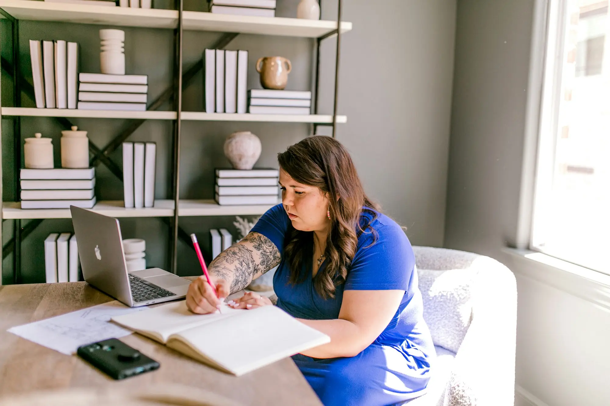 Business owner reviewing title papers at her kitchen table